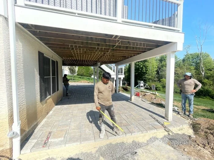 Residential hardscape creation with under deck and subsurface drainage renovation, landscape creation and low voltage lighting addition project in Jamison, PA